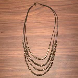 World Market gold/copper and black necklace.